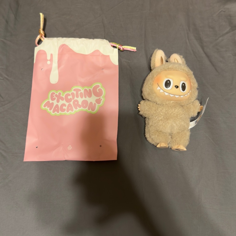 POP MART The Monsters Exciting Macaron Vinyl
Plush TOFFEE Labubu